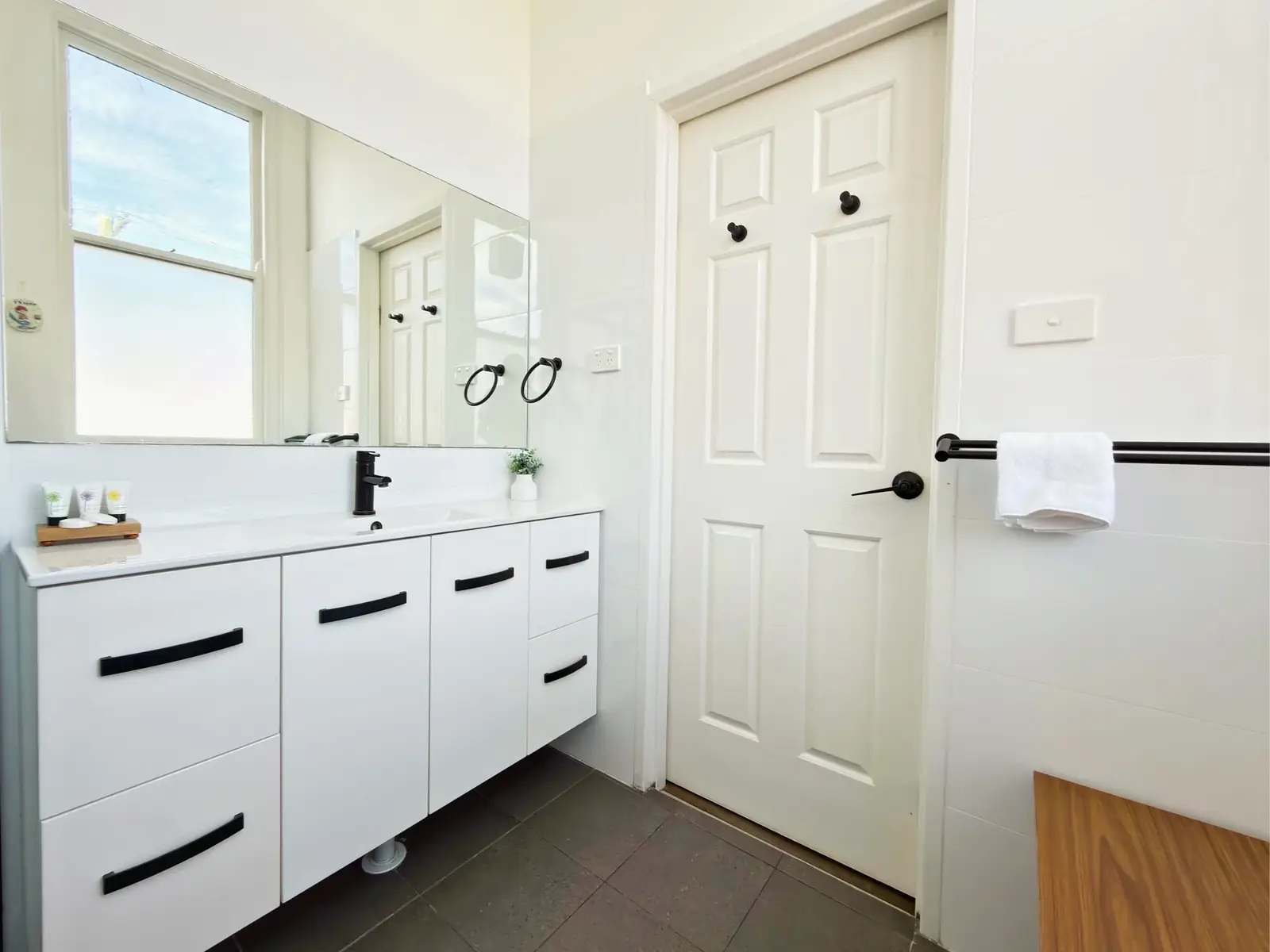 Bathroom vanity and mirror — King Room at Vine Valley Inn Cessnock