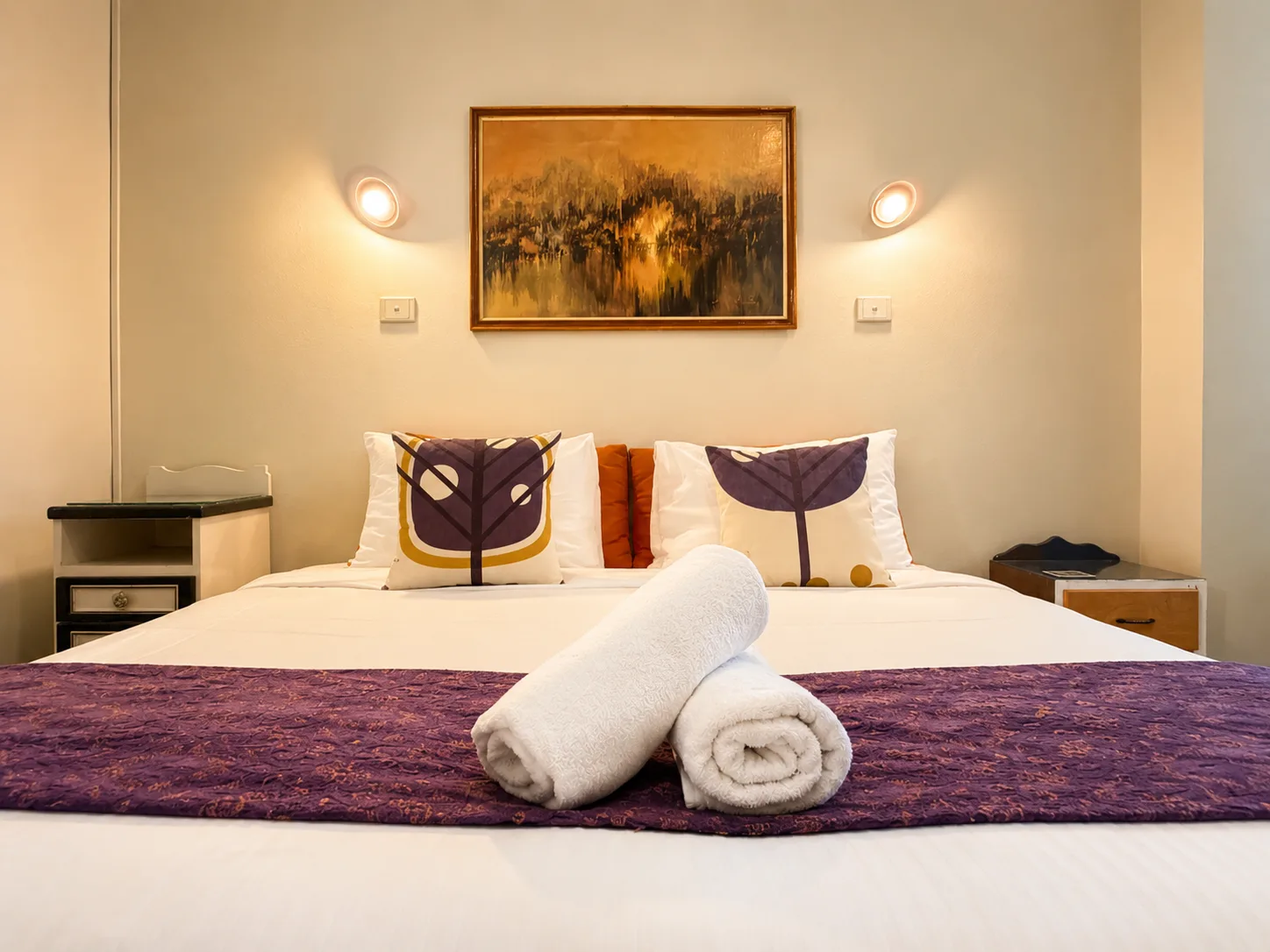 King bed with rolled towels — King Room at Vine Valley Inn Cessnock