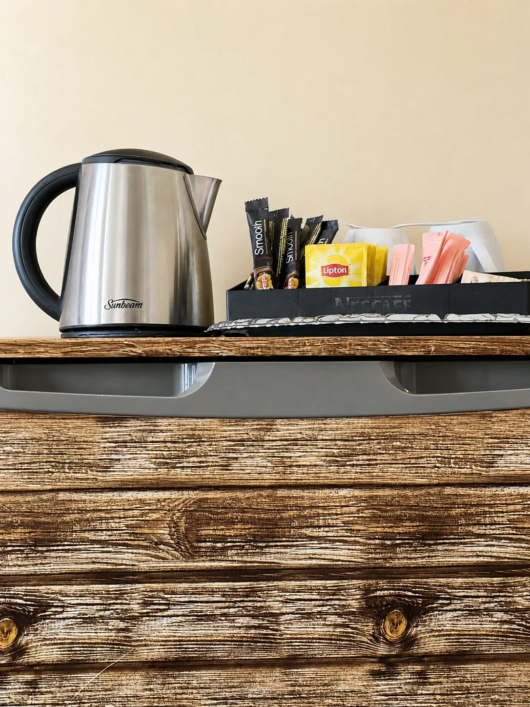 Kettle with tea and coffee selection — Queen Room at Vine Valley Inn Cessnock